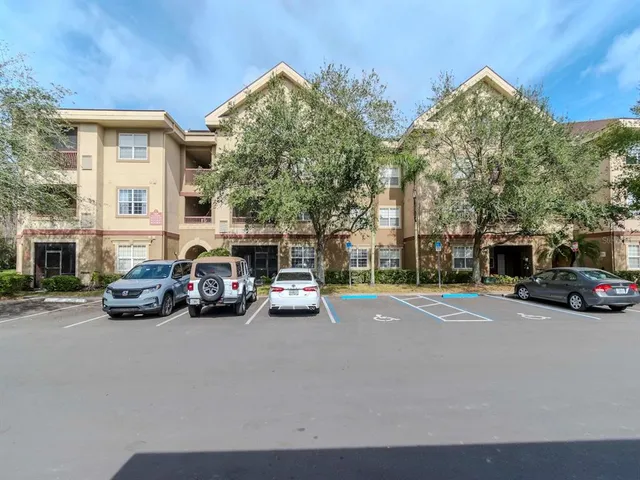 a view of a cars parked in front of a house