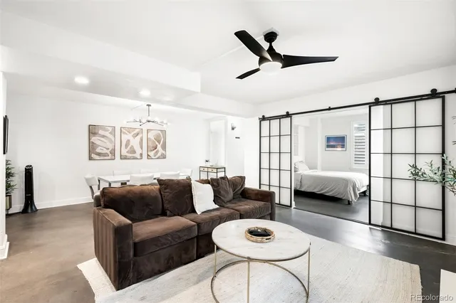 a living room with furniture and a window