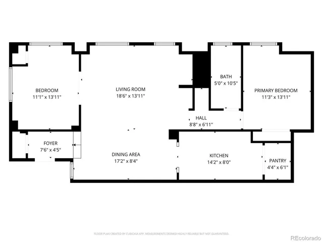 front view of a house with large trees