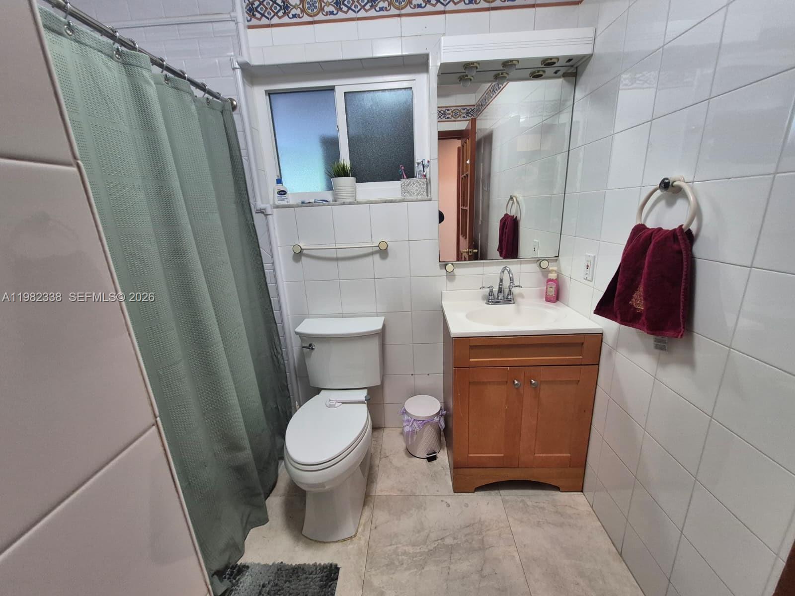 14530 Southwest 110th Street Miami, FL 33186 - Photo 30 of 45 a bathroom with a sink toilet and shower