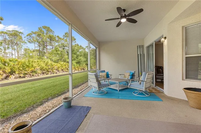 a living room with furniture and a yard