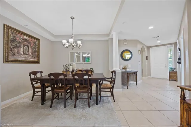a living room with furniture and view of kitchen
