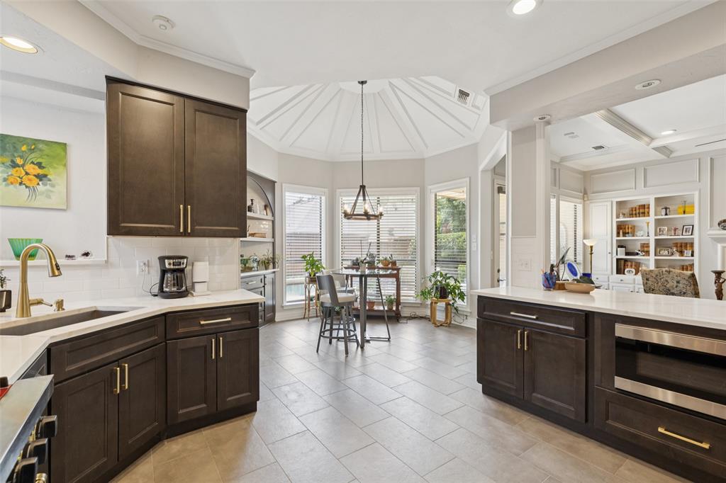 4136 Rainsong Drive Dallas, TX 75287 - Photo 30 of 30 a large kitchen with a lot of counter space and a sink