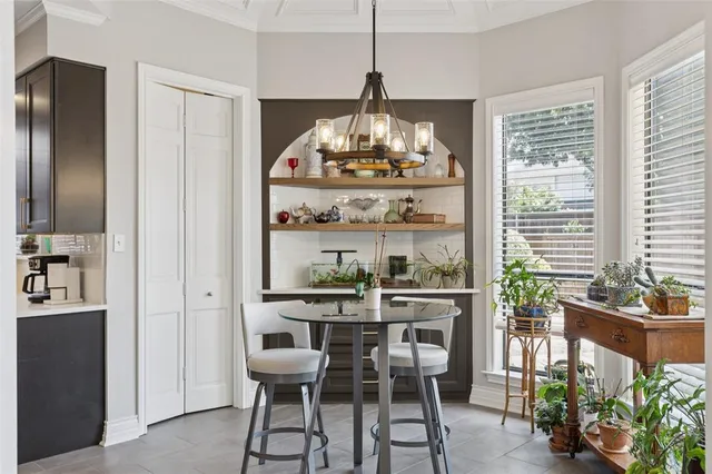 a kitchen with refrigerator and cabinets