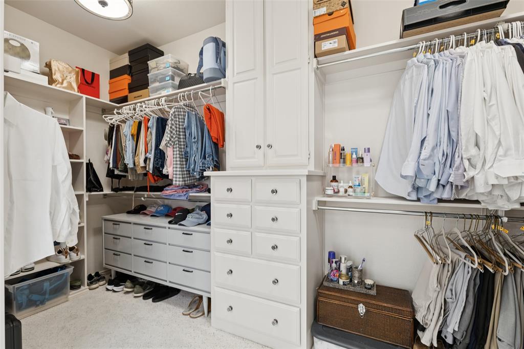 4136 Rainsong Drive Dallas, TX 75287 - Photo 16 of 30 a view of walk in closet with clothes and shoes