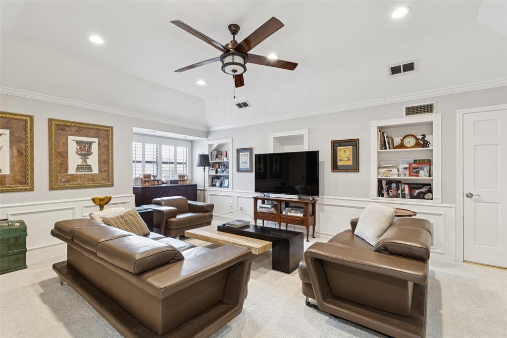 4136 Rainsong Drive Dallas, TX 75287 - Photo 18 of 30 a living room with furniture and a flat screen tv