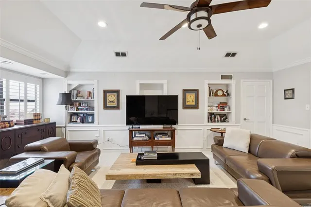 a bedroom with a large bed and a large window
