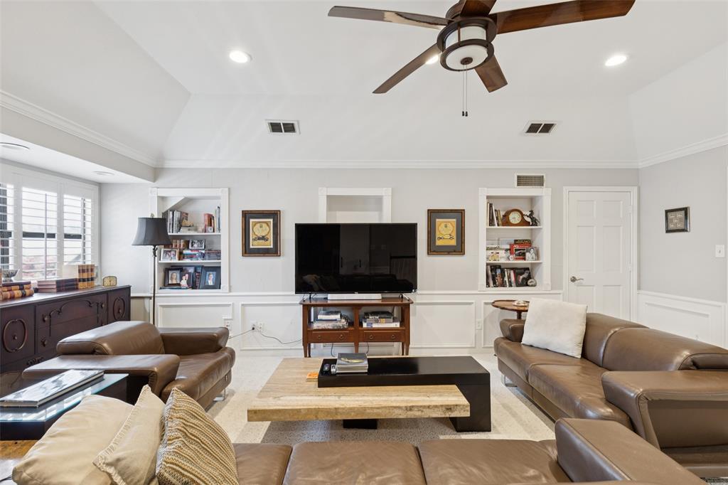 4136 Rainsong Drive Dallas, TX 75287 - Photo 19 of 30 a living room with furniture and a flat screen tv