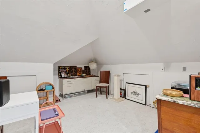 a living room with furniture ceiling fan and a rug