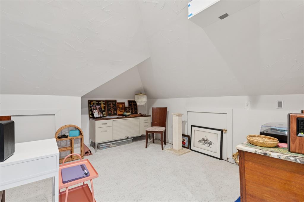 4136 Rainsong Drive Dallas, TX 75287 - Photo 22 of 30 a living room with furniture and a fireplace