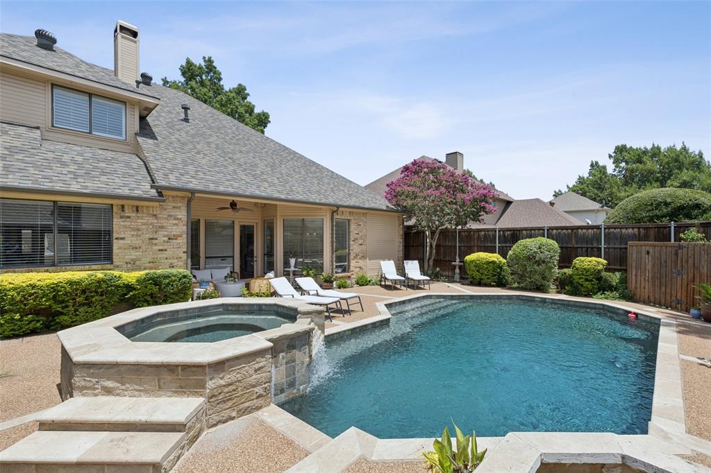 4136 Rainsong Drive Dallas, TX 75287 - Photo 26 of 30 a front view of a house with garden