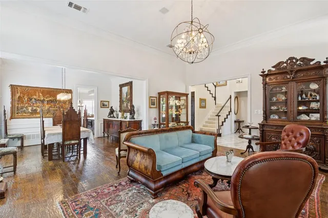 a view of a patio with couches table and chairs with potted plants