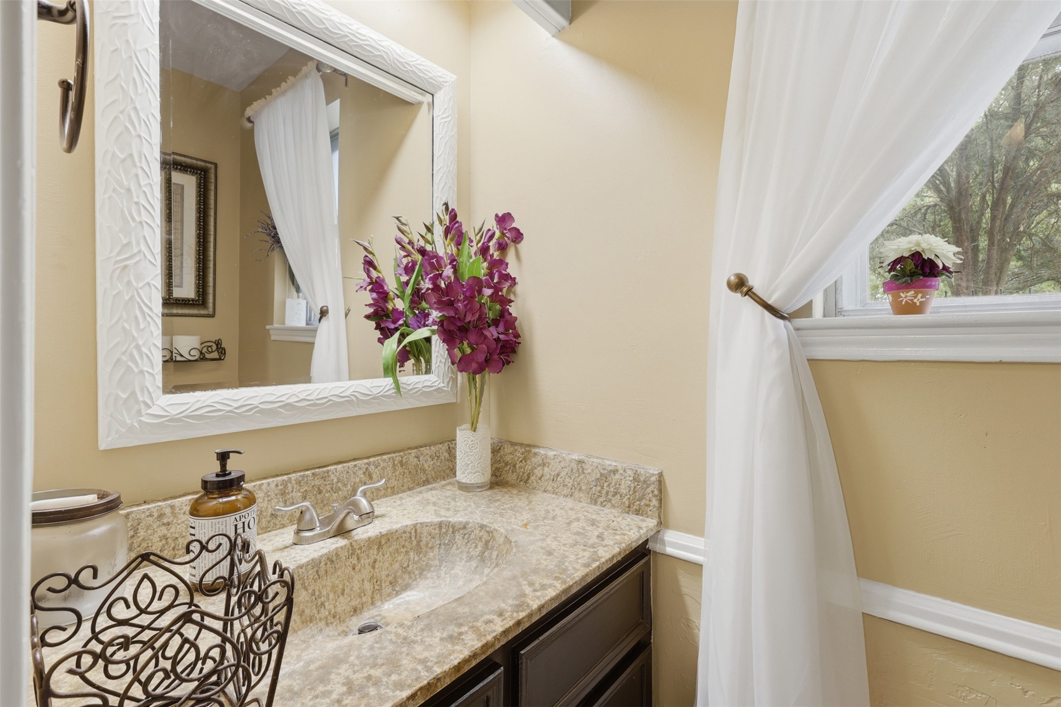 7010 River Mill Drive Spring, TX 77379 - Photo 14 of 29 a bathroom with a granite countertop sink and a mirror