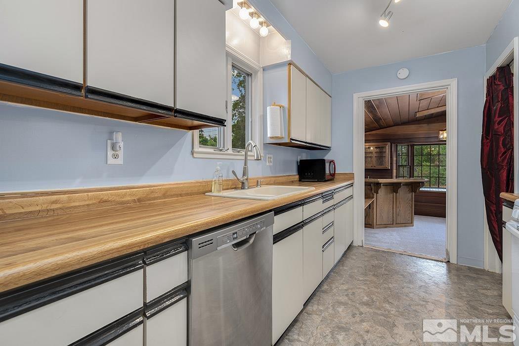 964 Gear Street Reno, NV 89503 - Photo 8 of 21 a kitchen with stainless steel appliances a sink and cabinets