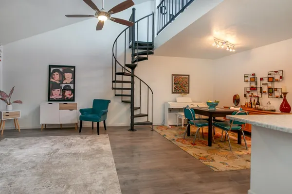 a view of a livingroom with furniture and a work space