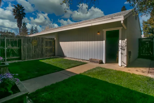 a view of a backyard with sitting area