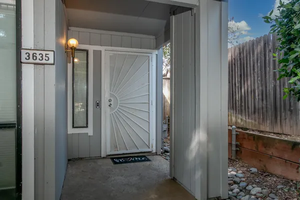 a view of a elevator with wooden door
