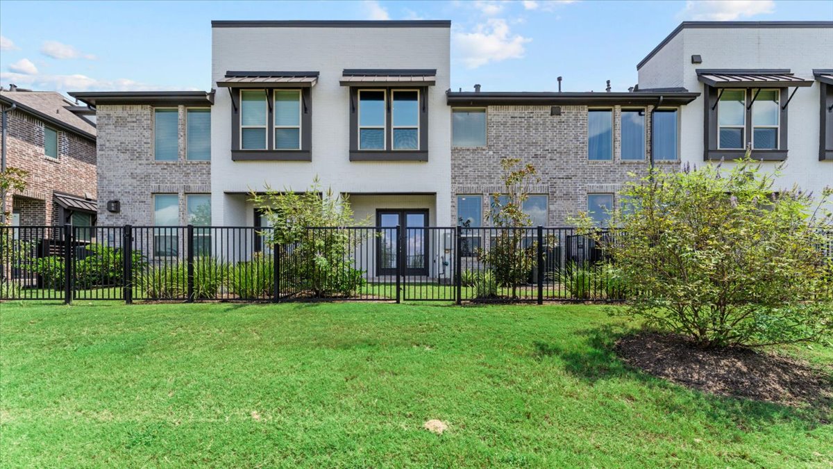 16627 Lake Austin Street Cypress, TX 77433 - Photo 15 of 32 a view of a brick house with a yard and plants
