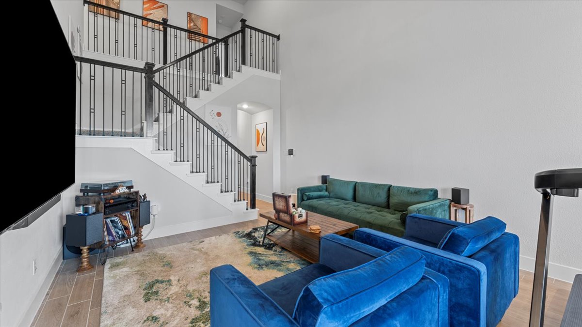 16627 Lake Austin Street Cypress, TX 77433 - Photo 24 of 32 a living room with furniture and stairs