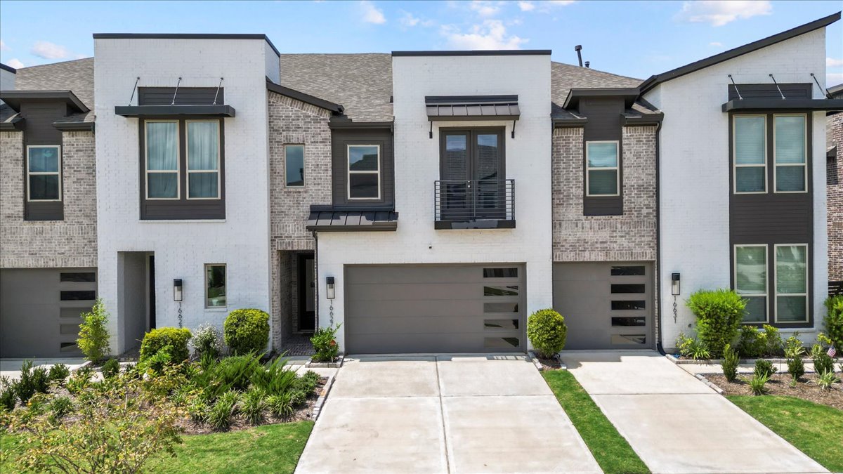 16627 Lake Austin Street Cypress, TX 77433 - Photo 3 of 32 a front view of a house with a yard and garage