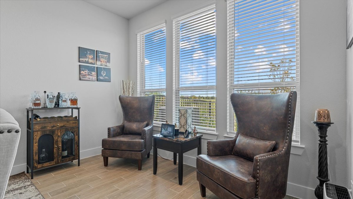 16627 Lake Austin Street Cypress, TX 77433 - Photo 9 of 32 a living room with furniture and a fireplace