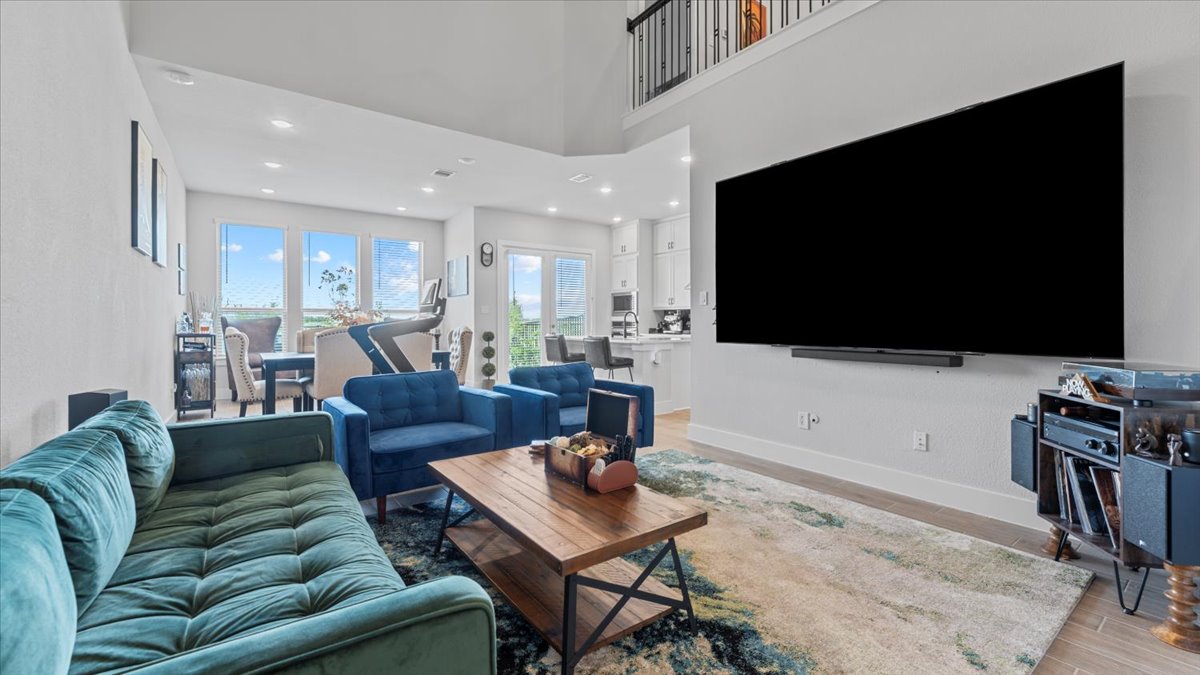 16627 Lake Austin Street Cypress, TX 77433 - Photo 10 of 32 a living room with furniture and a flat screen tv