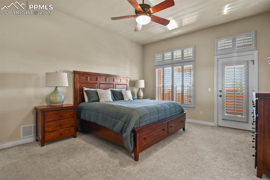 617 Concerto Drive Colorado Springs, CO 80906 - Photo 17 of 46 Another view of the large primary bedroom on the main floor of the home.