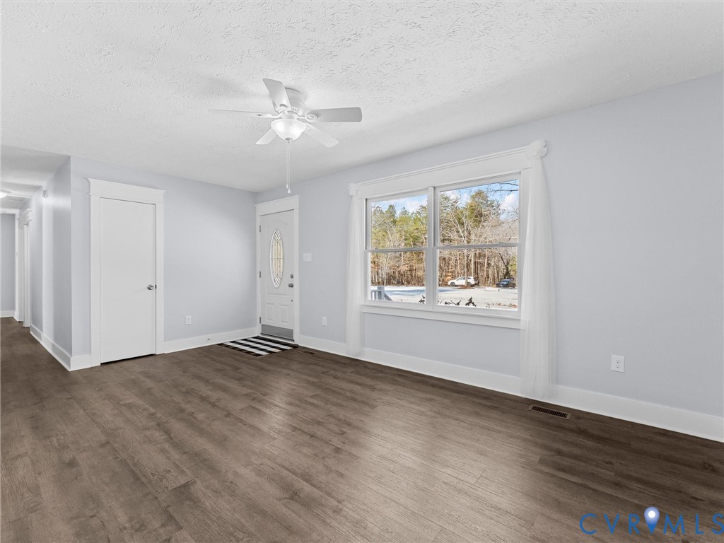 1339 Harris Creek Road Louisa, VA 23093 - Photo 12 of 46 a view of an empty room with wooden floor and a window