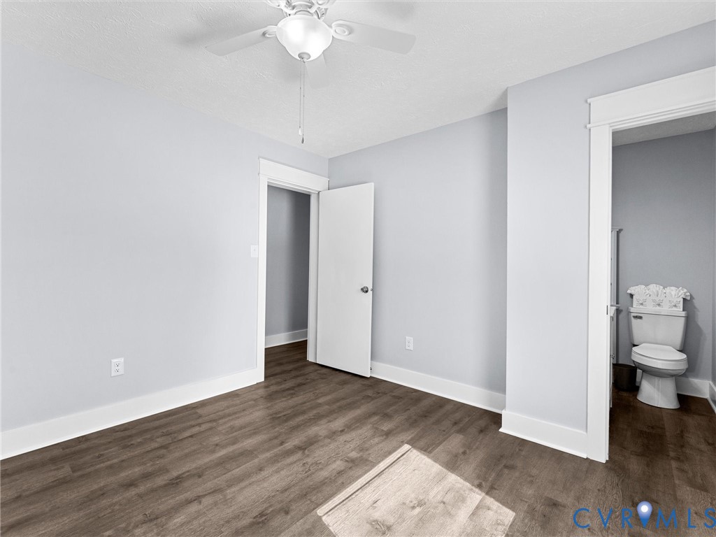 1339 Harris Creek Road Louisa, VA 23093 - Photo 22 of 46 a view of a room with wooden floor and a ceiling fan