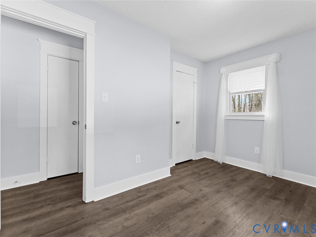 1339 Harris Creek Road Louisa, VA 23093 - Photo 27 of 46 an empty room with wooden floor and windows