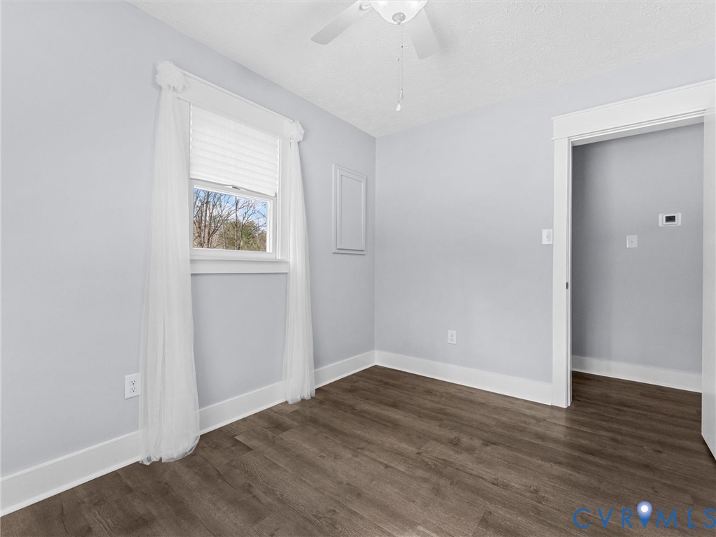 1339 Harris Creek Road Louisa, VA 23093 - Photo 33 of 46 an empty room with wooden floor and windows