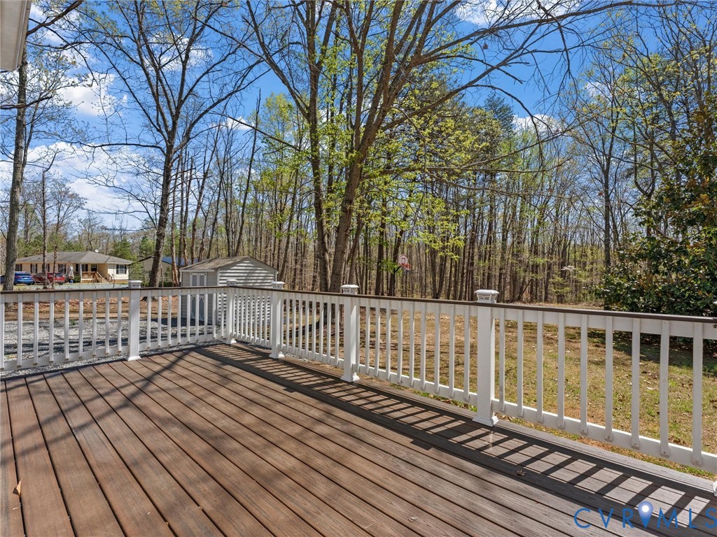 1339 Harris Creek Road Louisa, VA 23093 - Photo 35 of 46 a view of a wooden balcony with large trees