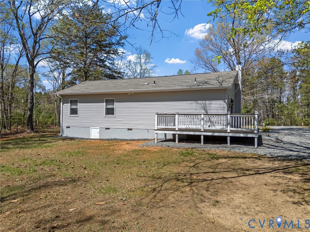 1339 Harris Creek Road Louisa, VA 23093 - Photo 36 of 46 a view of a house with a large tree and a yard