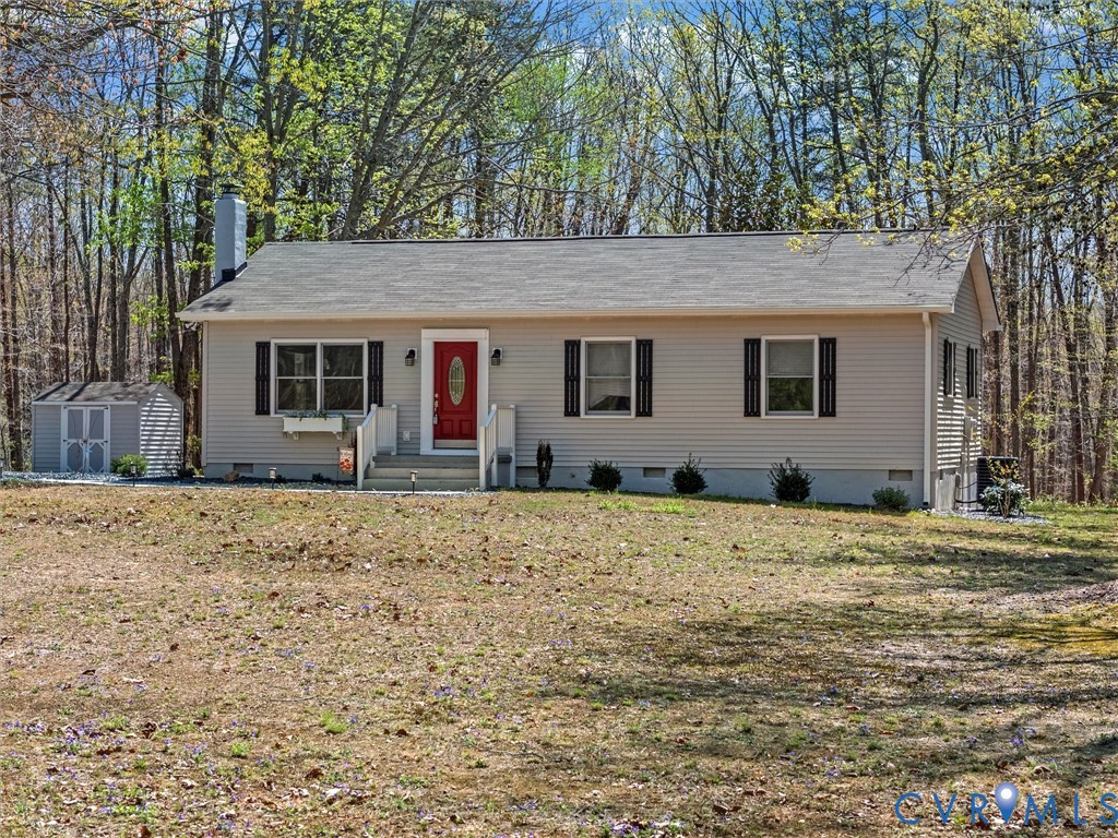 1339 Harris Creek Road Louisa, VA 23093 - Photo 4 of 46 a backyard of a house with large trees