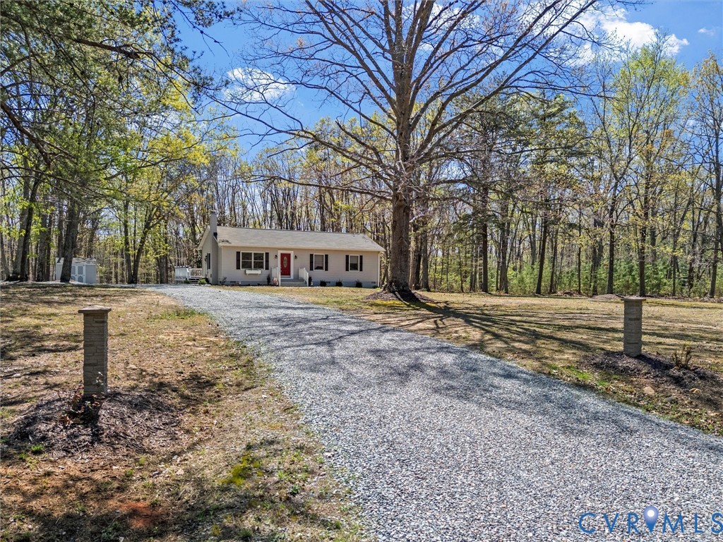 1339 Harris Creek Road Louisa, VA 23093 - Photo 5 of 46 a front view of a house with a yard
