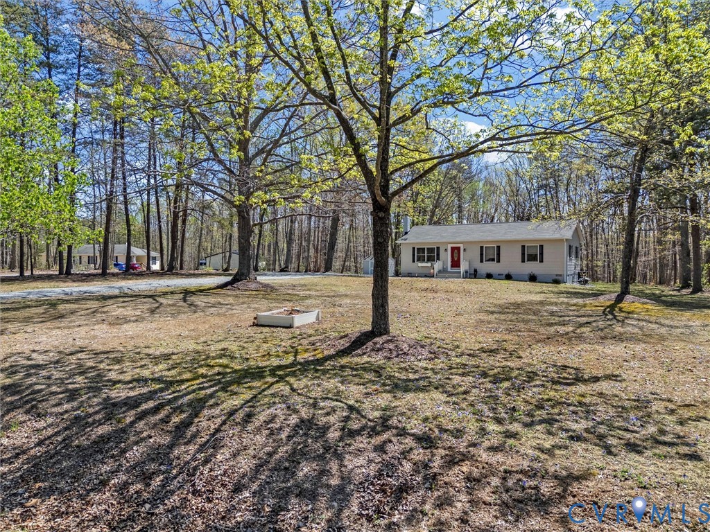1339 Harris Creek Road Louisa, VA 23093 - Photo 6 of 46 a house with trees in the background