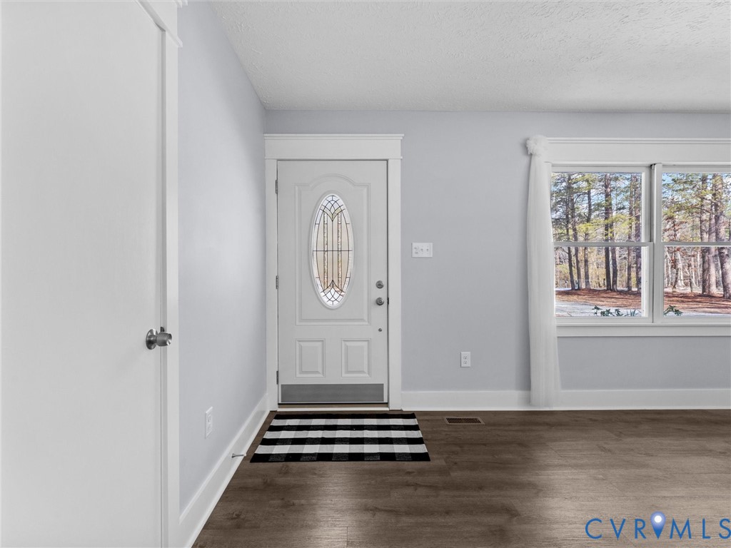 1339 Harris Creek Road Louisa, VA 23093 - Photo 9 of 46 an empty room with wooden floor and windows