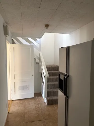 a view of entryway with stairs and a window