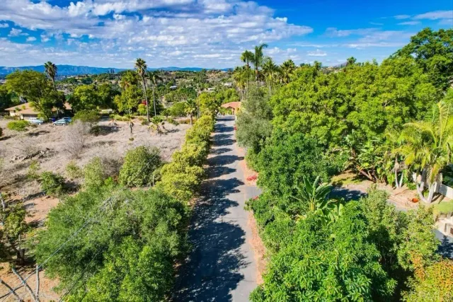 an aerial view of a houses with a yard