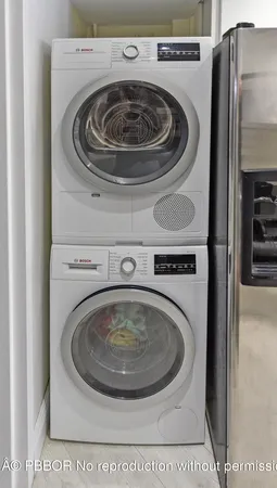 a bedroom with furniture and a baby crib