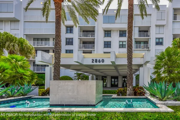 a front view of a building with garden