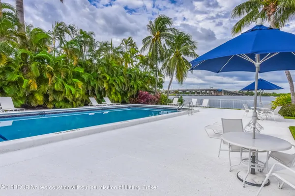 a view of a chair and table in the garden