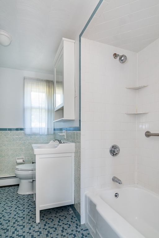 14 Rosslare Road Framingham, MA 01701 - Photo 11 of 20 a bathroom with a sink a toilet and shower