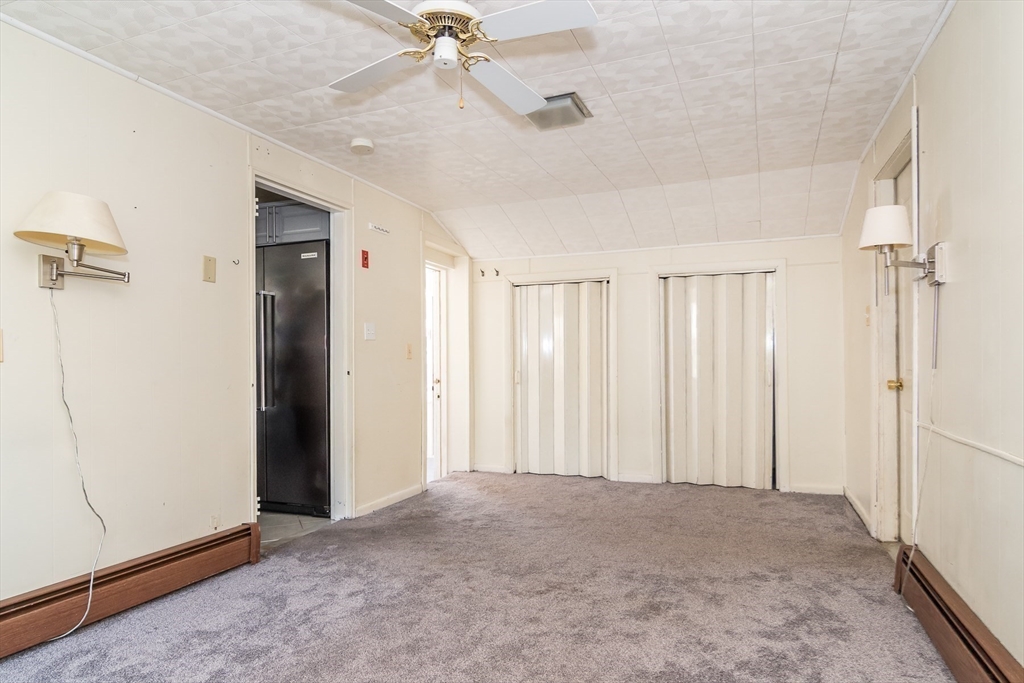 14 Rosslare Road Framingham, MA 01701 - Photo 16 of 20 a view of a livingroom with a ceiling fan & entryway