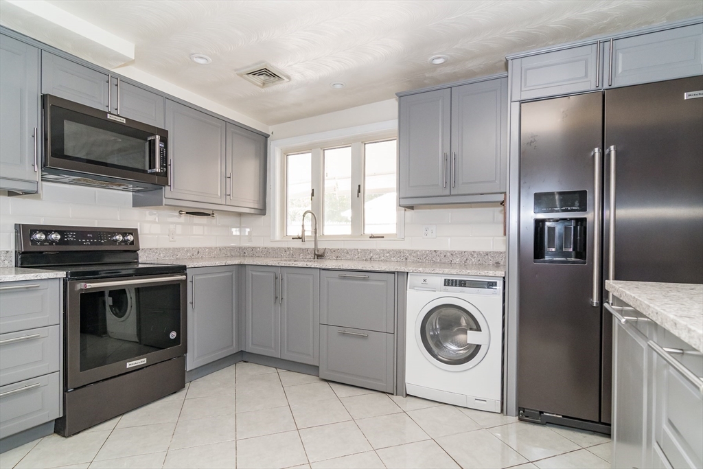 14 Rosslare Road Framingham, MA 01701 - Photo 4 of 20 a kitchen with granite countertop cabinets and steel stainless steel appliances