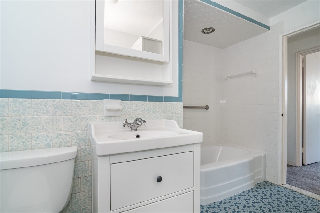 14 Rosslare Road Framingham, MA 01701 - Photo 10 of 20 a bathroom with a sink a toilet and shower