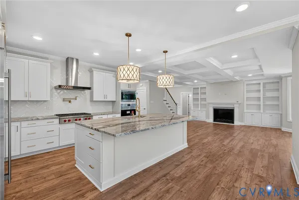 a large kitchen with a stove and a sink