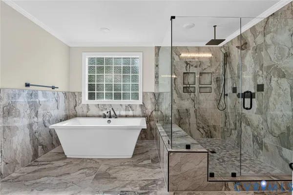 a bathroom with a bathtub and shower