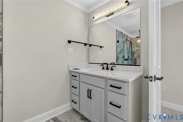 a bathroom with a sink a vanity and a mirror