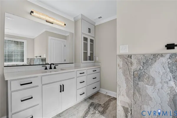 a bathroom with a double vanity sink mirror and double